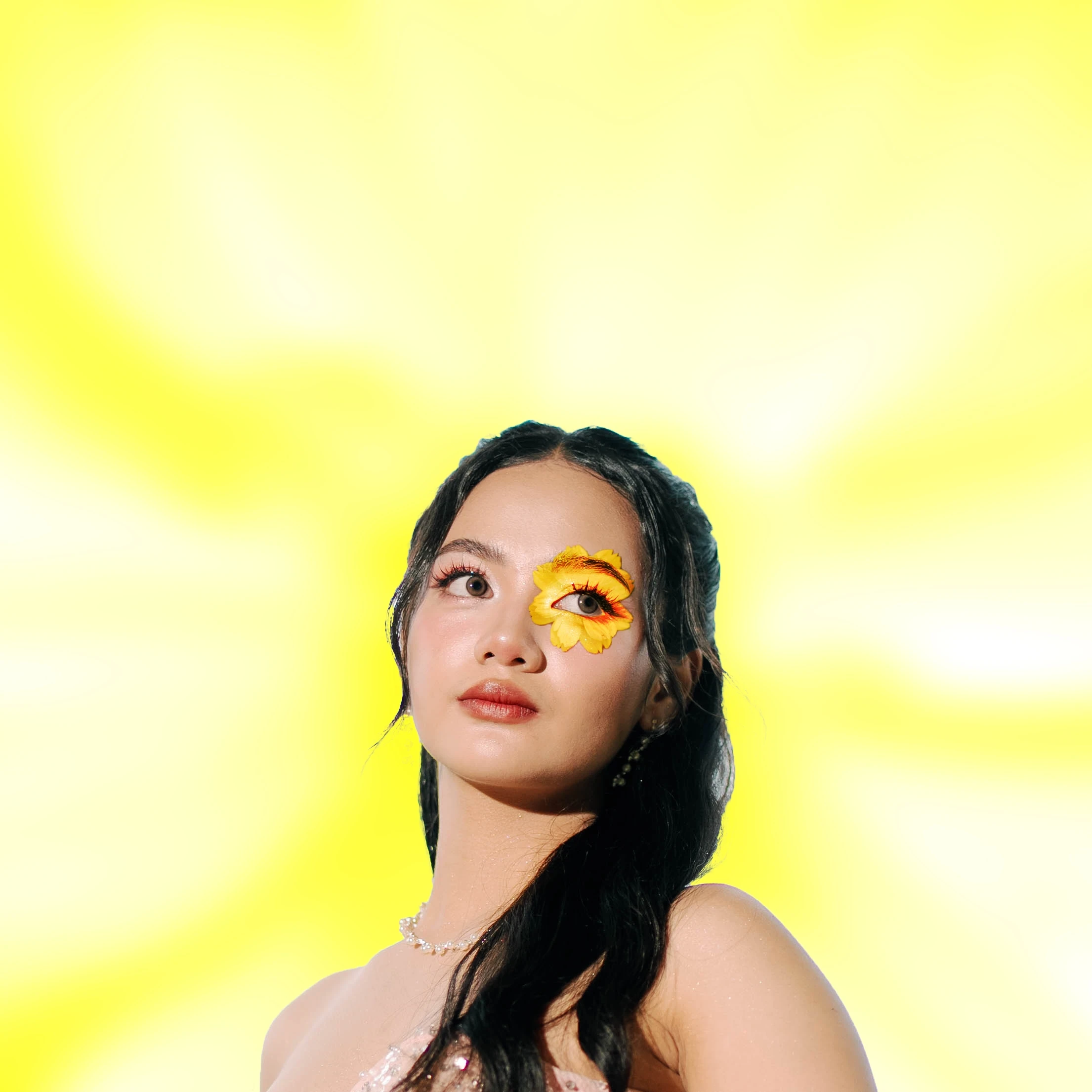 A portrait against a vivid yellow background